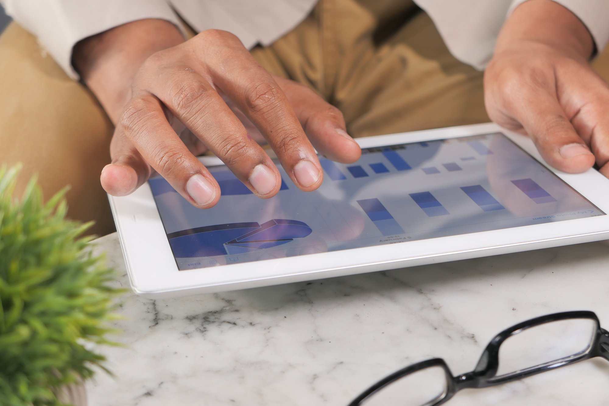 man-s-hand-working-on-digital-tablet-at-office-des-2023-11-27-04-49-41-utc